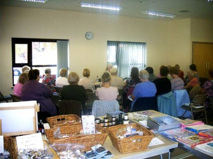 The crafters listen and watch Erica’s demonstration before having a go themselves with the products on offer. Picture Credit: Erica Evans