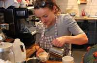 Natalie prepares a cappuccino