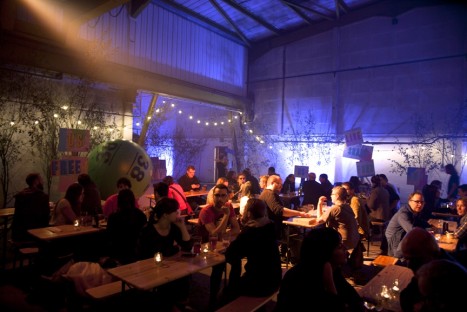 Customers dig in at the Depot. The low lighting and art installations make for an ethereal setting.