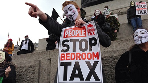 A protester demostrating against the bedroom tax in London. Image courtesy of Flickr user Paul Bevan and used under a Creative Commons license.