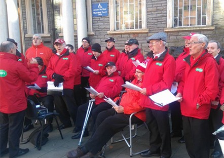 Maesteg Gleeman Male Voice Choir performing outside Maesteg Town Hall on Saturday
