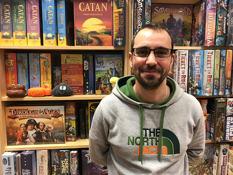 A man stands in a board game shop