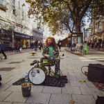 A busker, Cliff Collings, at his drum set on Queen Street