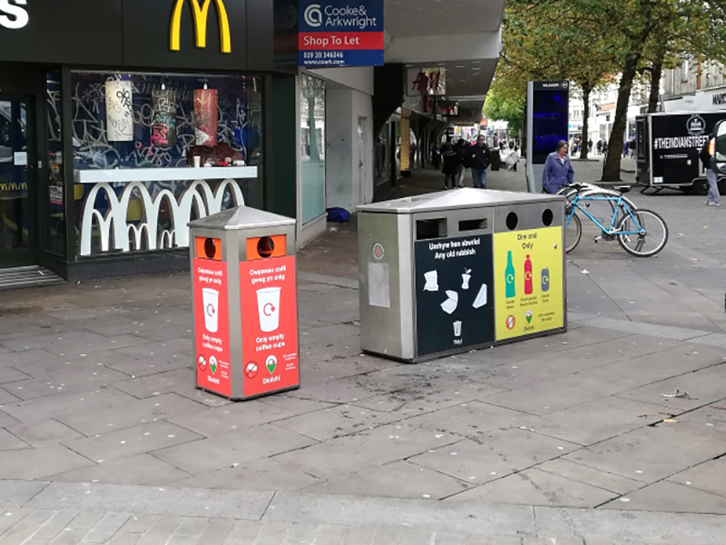Coloured recycling bins outside McDonalds