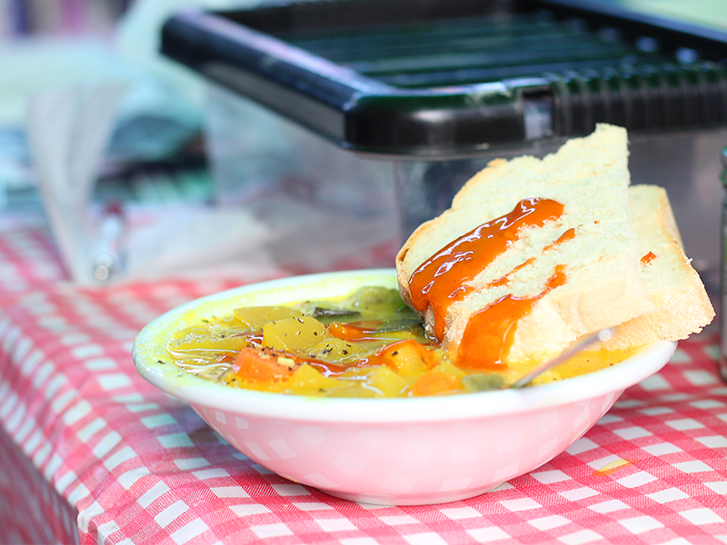 a bowl of hot soup and bread, shared on Black Friday by Green Friday activists