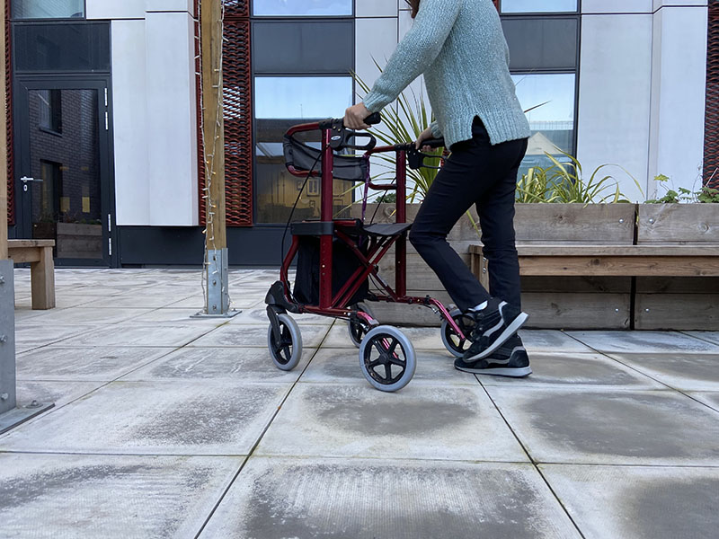 person walking with a walking frame