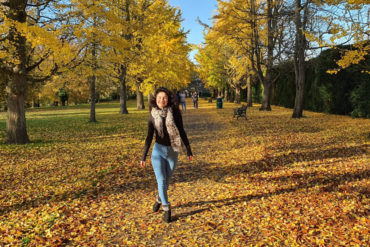 Wendy walking through an autumnal park