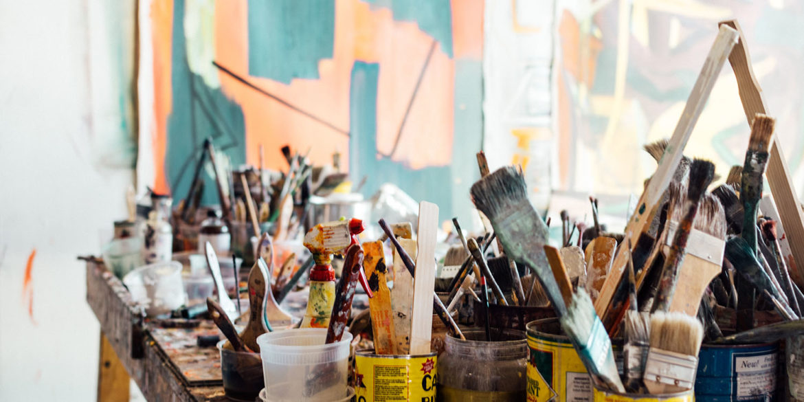 Artists studio with paintbrushes and pots