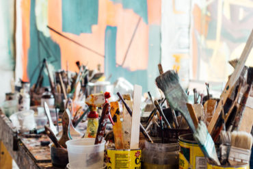 Artists studio with paintbrushes and pots
