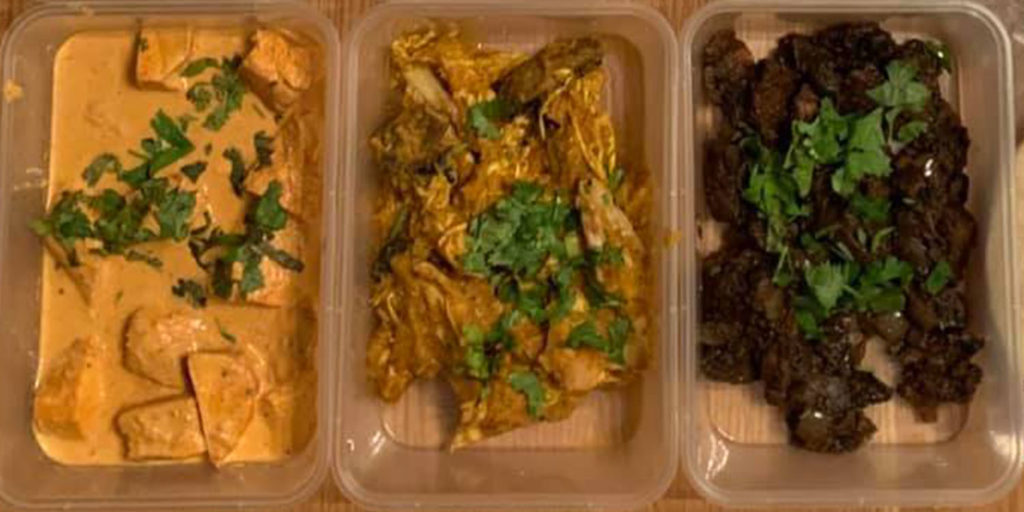 Tupperware boxes containing takeaway curry to raise money for Cardiff Foodbank