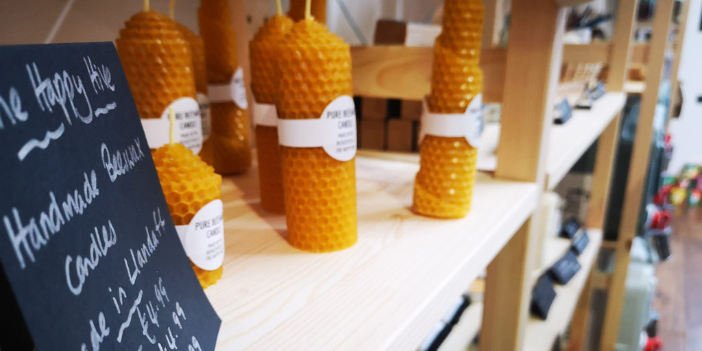 Beeswax candles on a recycled wooden shelf