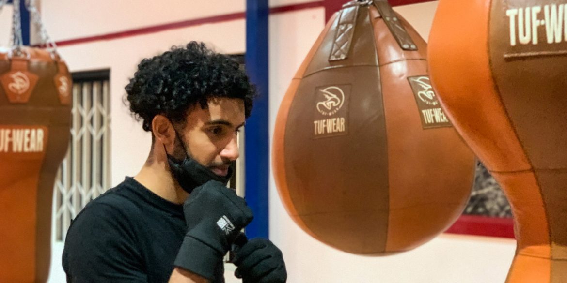 Eighteen-year-old student, Mohammed Ali trains in the boxing space