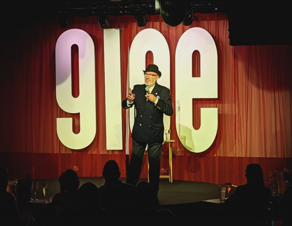 Steve Jameson performing on the Glee Club stage. 