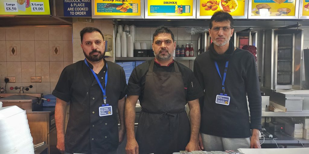 Workers in Victoria Fish Bar in Whitchurch, Cardiff who will provide free Christmas meals