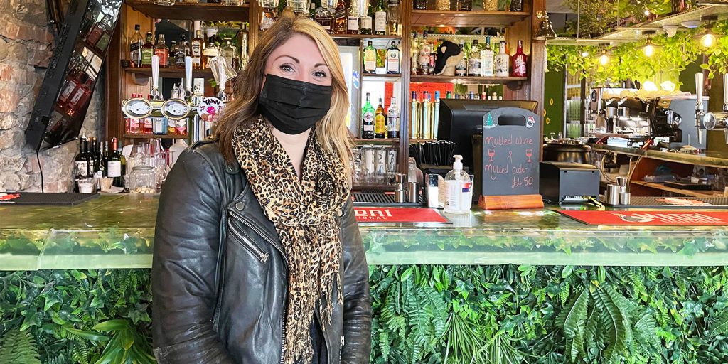 Georgina Heffernan stands by the bar/cafe in the middle of Corp Market; she is the operations manager of the place that houses sustainable independent businesses