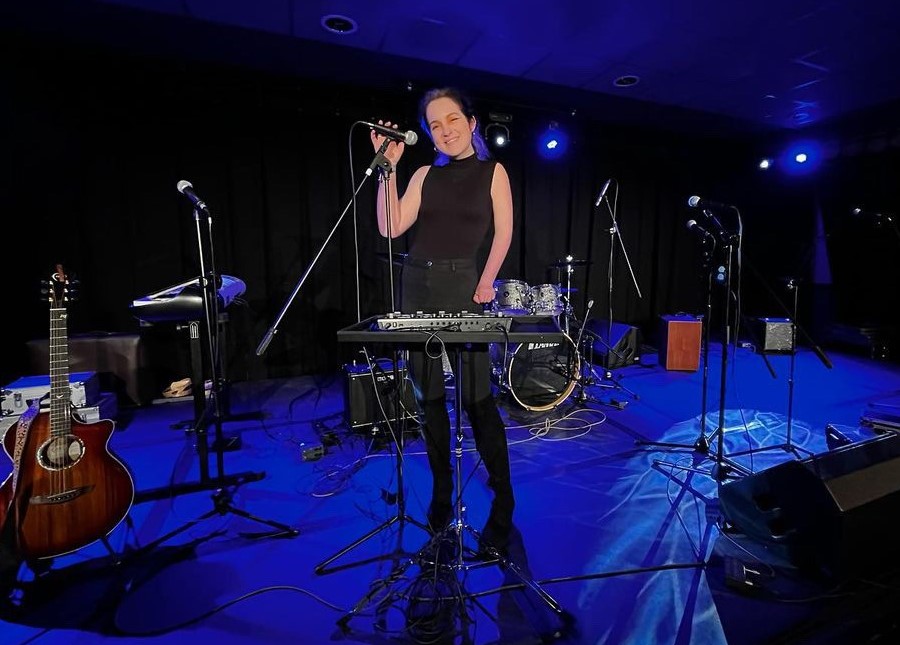 Disabled musician Rhiannon Barber performing at Breakout Festival