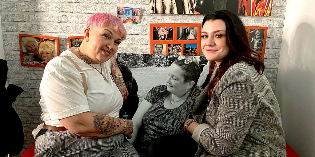 two women sat down with a picture of their friend in between them at their lgbtq+ friendly salon