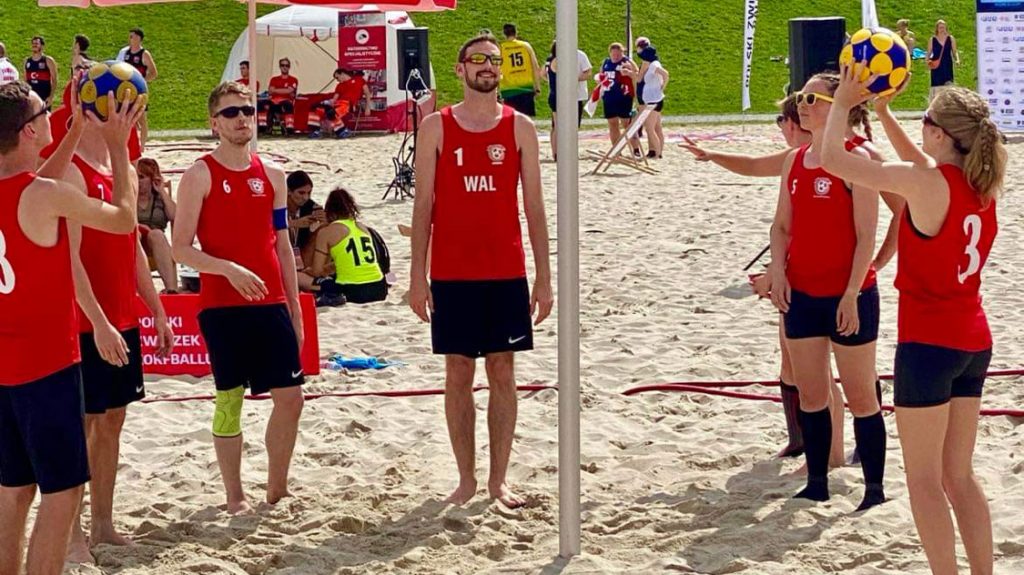 the Welsh beach korfball team practise shooting around the korf, 2023