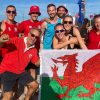 The Welsh beach korfball team and supporters holding the Welsh flag at the Beach Korfball World Cup in Poland, 2023.