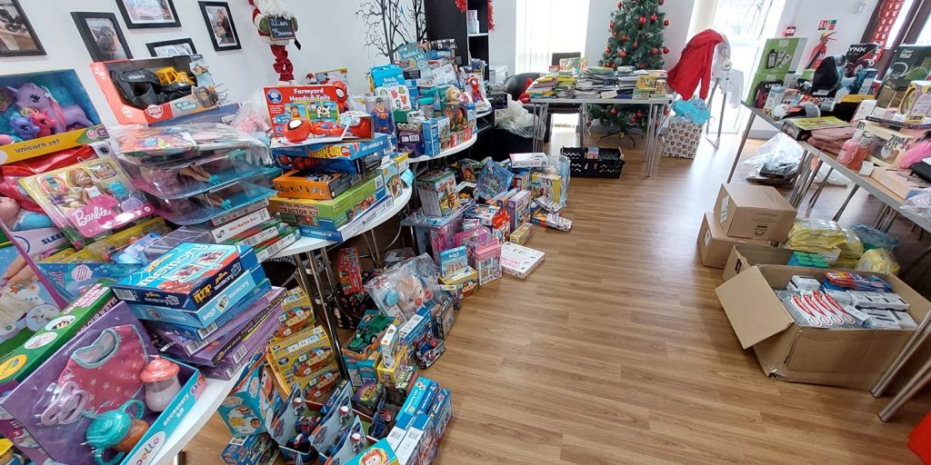 the overwhelming response to Canolfan Pentre's toy appeal as tables are flooded with gifts