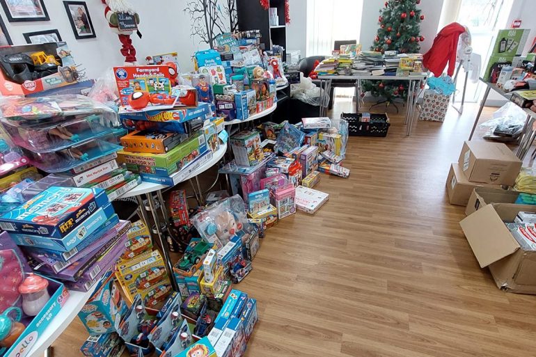 the overwhelming response to Canolfan Pentre's toy appeal as tables are flooded with gifts