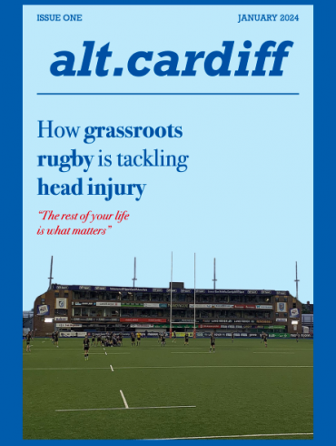 Magazine cover showing a rugby pitch