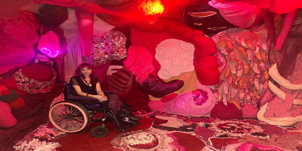 disabled artist Delphi shows off her exhibition