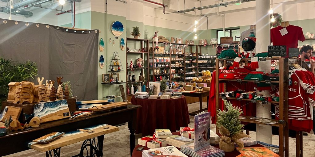 A picture of the shop floor, a grey curtain in hides the new cafe, set to open on 1 December