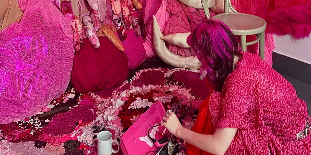 Campbell at work fixing her soft-sculpture installation that is inspired by her experience of disability 