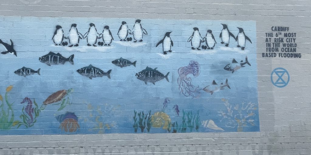 a mural in Roath reads "no ice caps, no Cardiff", stating that Cardiff is the sixth most at-risk city for climate related flooding