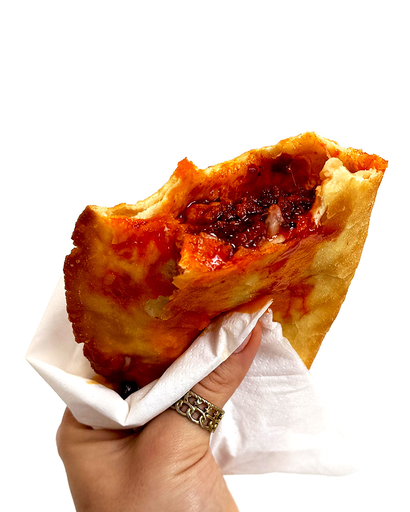 Panzarotto, is an Italian deep-fried street food, filled with mozzarella and spicy sausage.