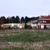 The old Michaelston College site, showing fencing all over the ground and the children's centre in the distance.
