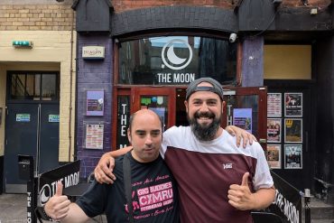 Richie and Mark standing outside The Moon with thumbs up