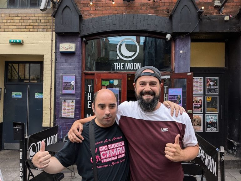 Richie and Mark standing outside The Moon with thumbs up