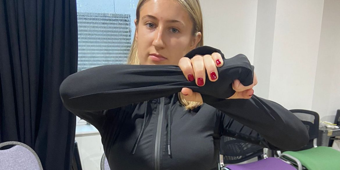 Blond girl does an athletic pose