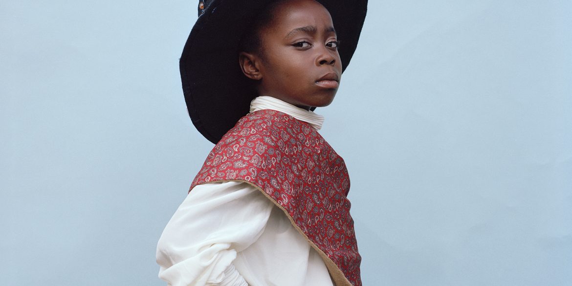 A Black school child in Traditional St David's day dress.