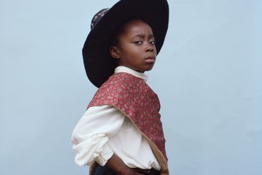 A Black school child in Traditional St David's day dress