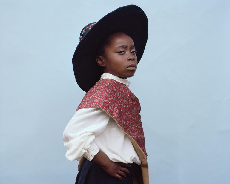 A Black school child in Traditional St David's day dress