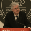 Mark Drakeford stands at a lectern.