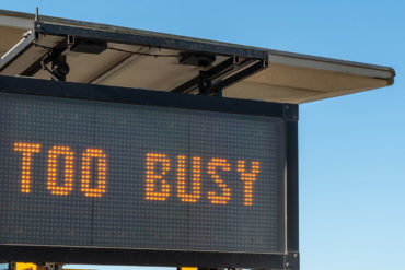 A big sign saying 'too busy' to appeal to people who struggle with goal setting