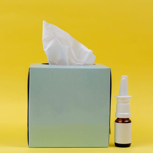 blue tissue box and nasal spray
