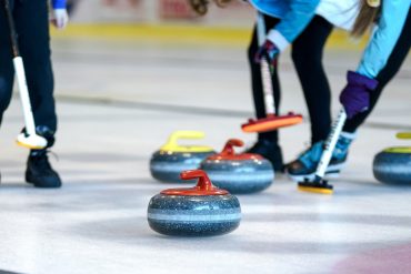 Curlers on curling rink
