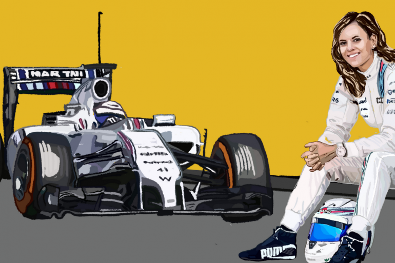 Susie Wolff in her Williams Formula One Team race suit with a Formula One car in the background