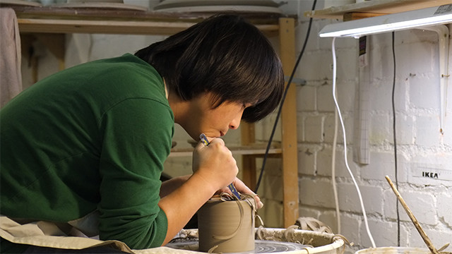 Jin eui Kim working in his studio