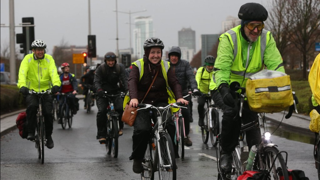 Cyclists ride to Senedd Steps to join the rally. 