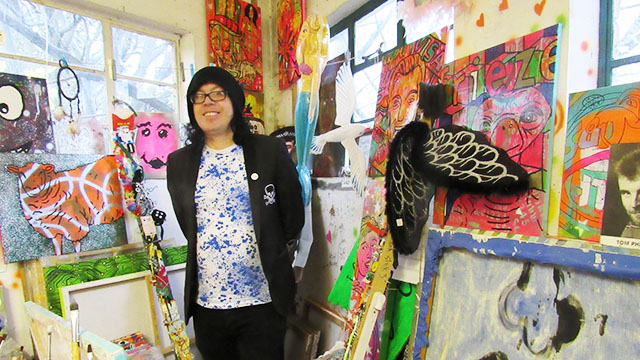 Barrie J. Davies in his studio filled with crazy colours and unpredictable things.