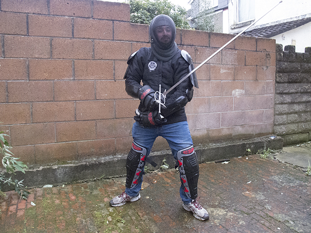 Nick Laing in full protective gear for HEMA sword fighting