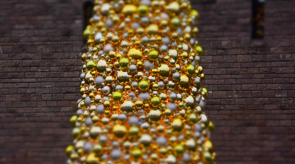 The tree is covered in golden baubles