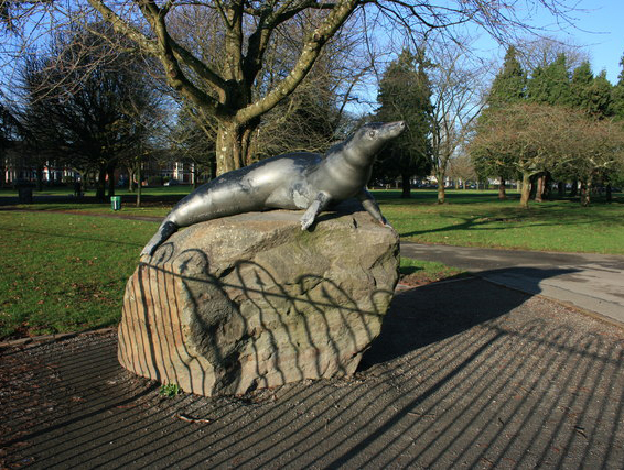 Billy the seal statue bathing in the sunset glow.