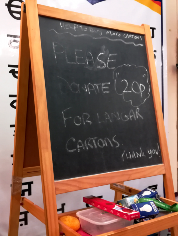 Sign requesting for langar donations. 
